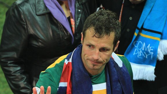 Overwhelmed... Socceroos captain Lucas Neill weeps following their elimination.