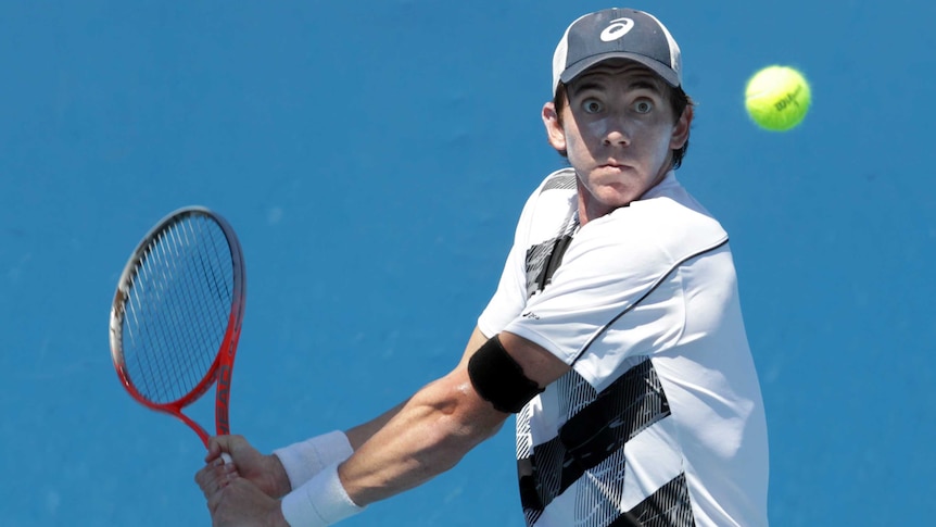 Eye of the tiger ... Australia's John-Patrick Smith in action against Portugal's Joao Sousa.