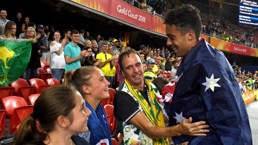 Australian athlete Luke Mathews celebrates with his family