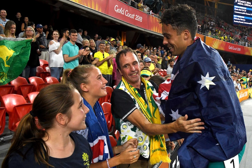 Australian athlete Luke Mathews celebrates with his family