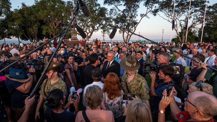 crowds gather around the prime minister