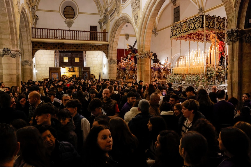 A group of people gathering inside a church.
