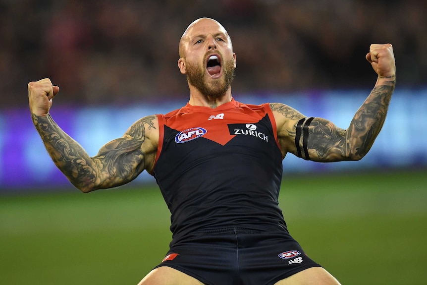 Nathan Jones celebrates a goal for the Demons against the Cats.