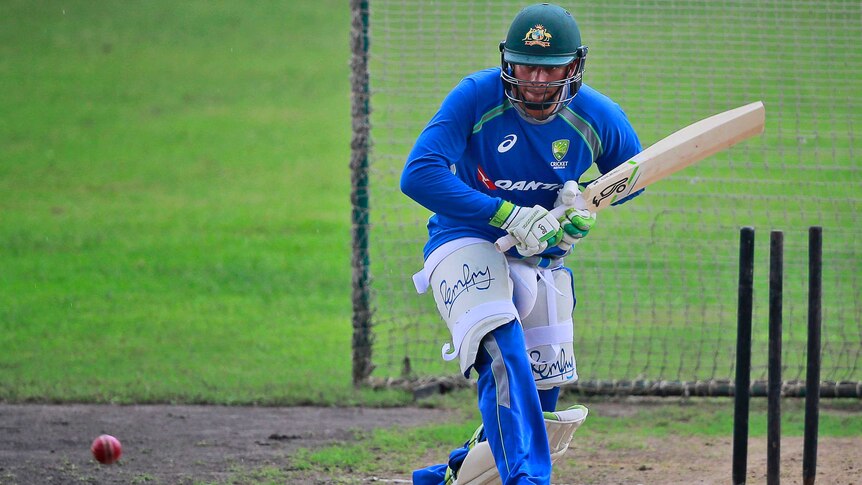 Australia's Usman Khawaja bats wearing no front pad during a practice session in Dhaka.
