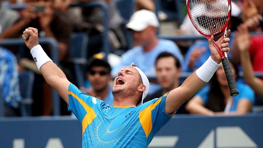 Lleyton Hewitt celebrates winning his match against Evgeny Donskoy at the US Open.