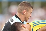 Tight tussle ... Jarryd Hayne (R) is tackled by Todd Carney