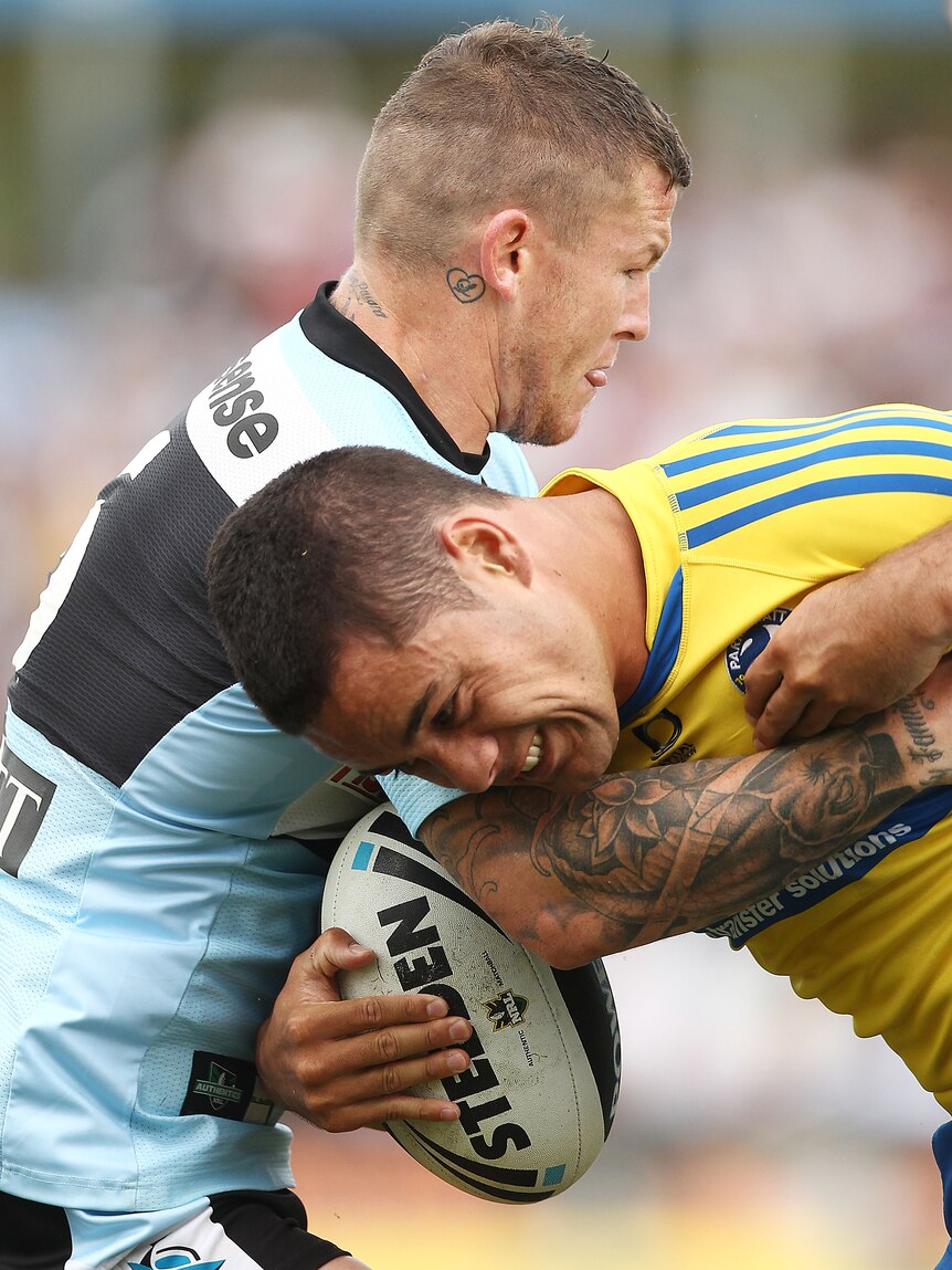 Tight tussle ... Jarryd Hayne (R) is tackled by Todd Carney