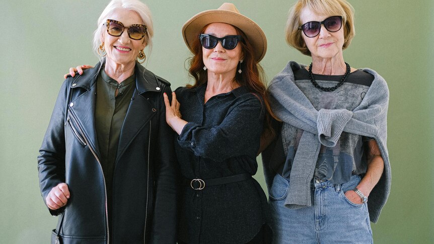 Three women wearing sunglasses