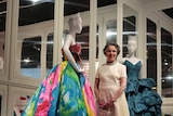 Dior house model from the 1950s, Svetlana Lloyd, stands next two a colourful dress