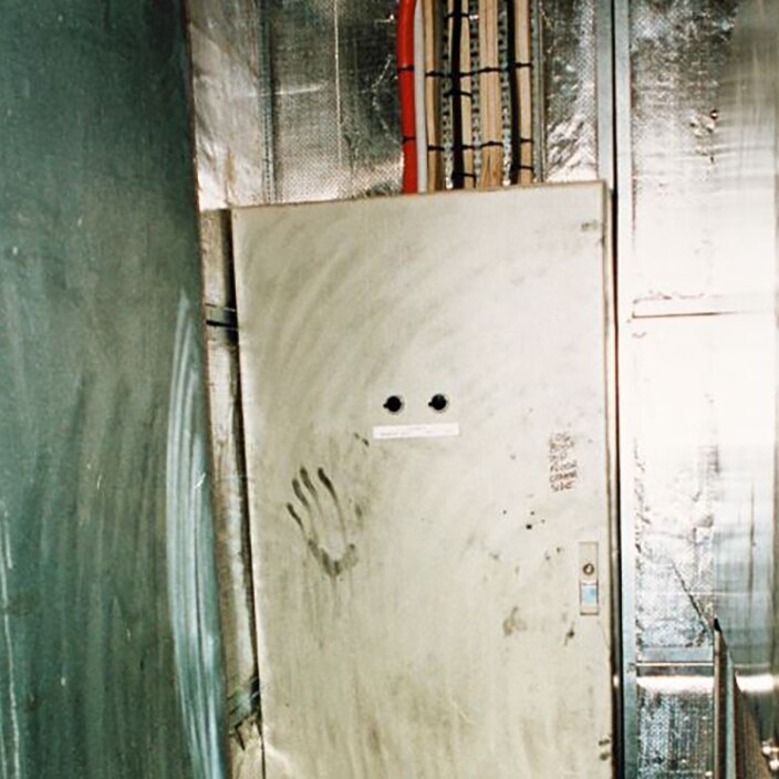 A handprint on an air-conditioning unit