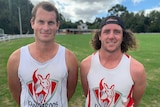 Travis Manne (left) and Brent Cooper standing at the Fish Creek footy ground.