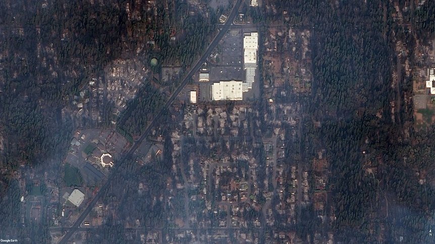 A satellite photo showing dozens of burnt-out homes that surround the Paradise Plaza shopping centre.