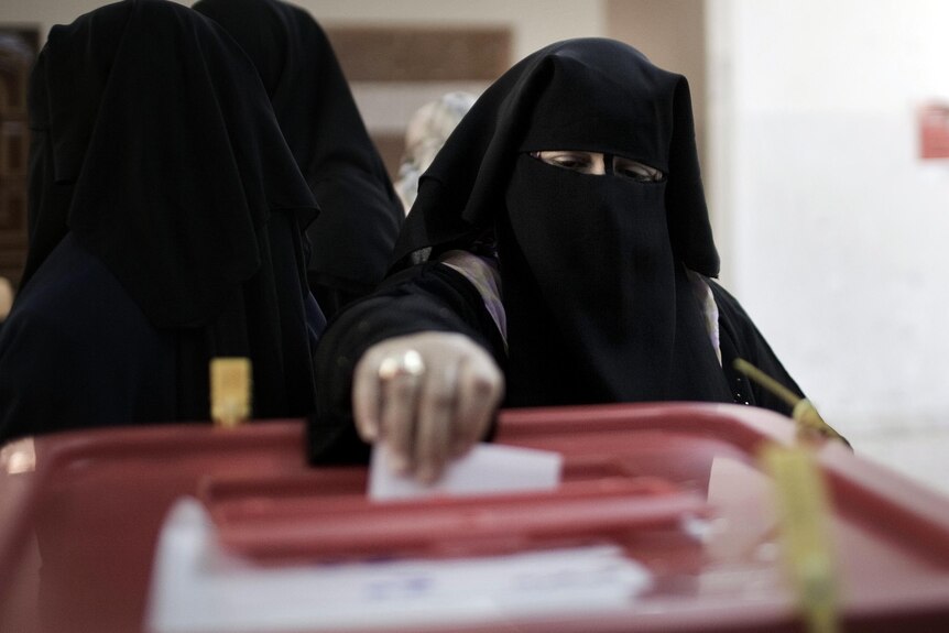 A Misrata resident casts her ballot during local council elections.