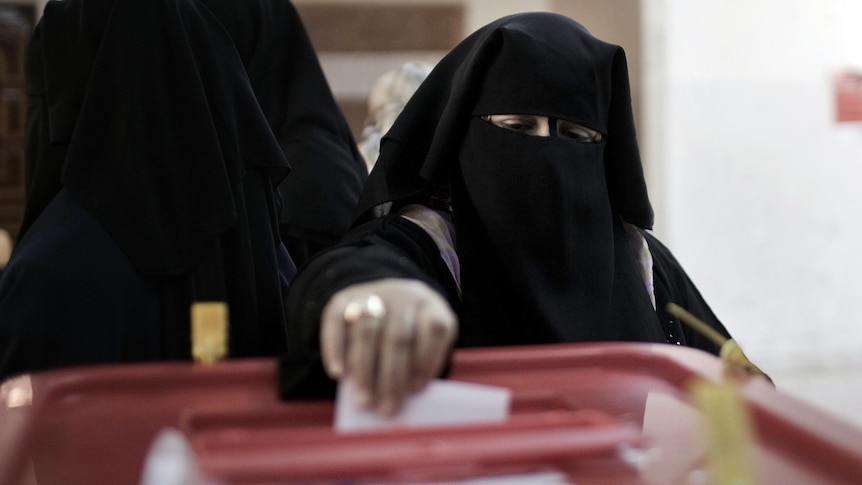 A Misrata resident casts her ballot during local council elections.