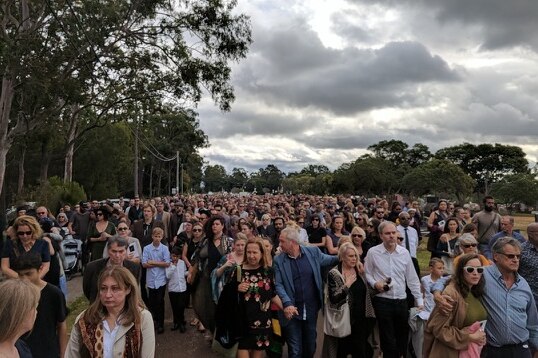 Alice Eather funeral attendees walk