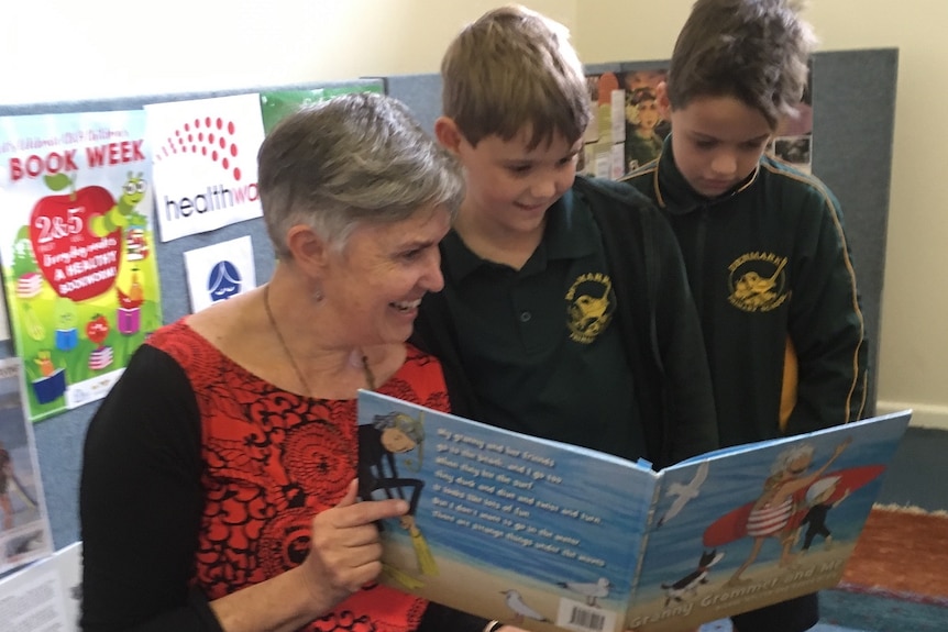 Dianne Wolfer reading her book to students