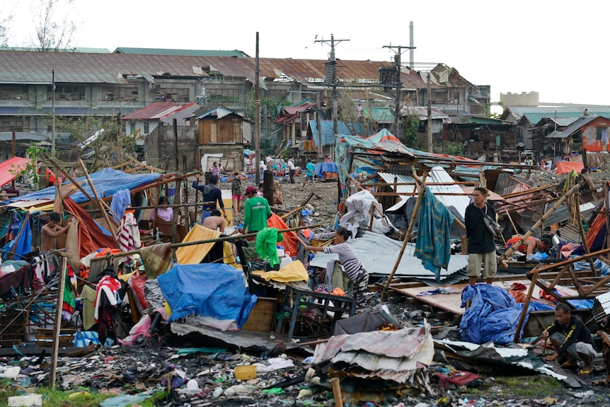 People search through the debris after the typhoon.