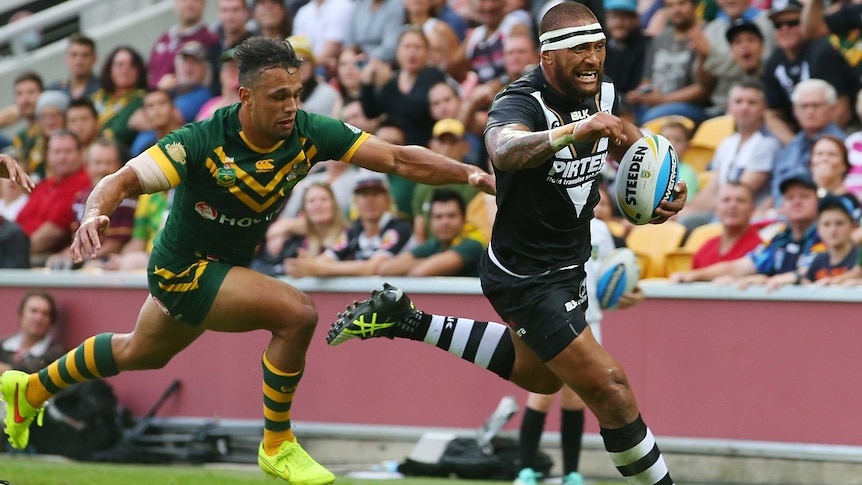 Manu Vatuvei makes a break to score a try for New Zealand against Australia at Lang Park