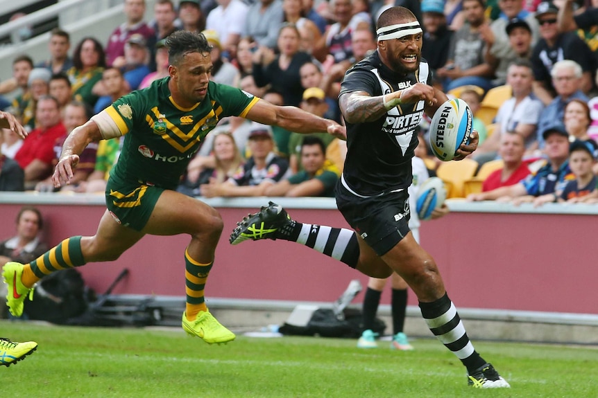 New Zealand's Manu Vatuvei scores a try against Australia in the Anzac Test at Lang Park.