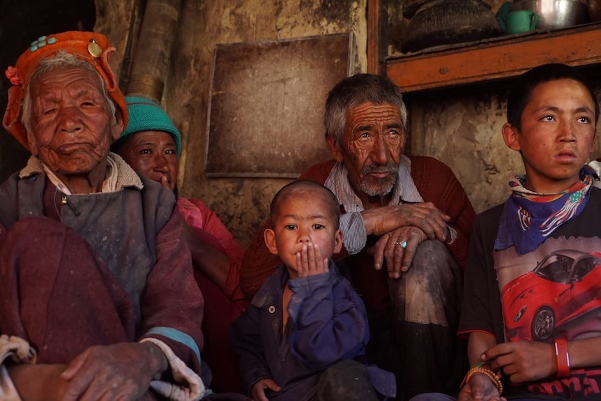 A group of people sitting together.