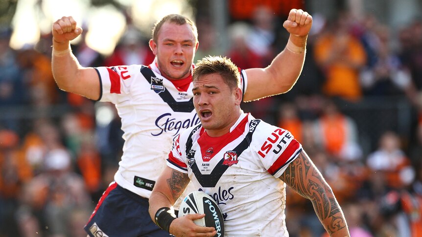 Roosters crow ... Martin Kennedy (L) celebrates Jared Waerea-Hargreaves' first-half try.