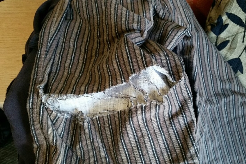 A photo of Ernie Poloni's pyjamas taken by one of his relatives shows a large tear in the fabric.