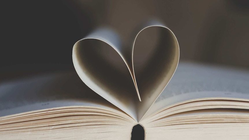 Pages in a book flip to make the shape of a heart.