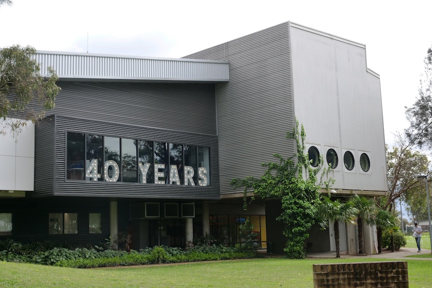 A grey building with a sign reading "40 Years"