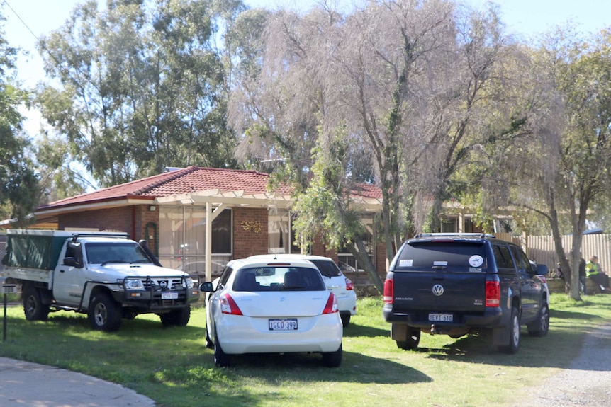 An exterior shot of Barko's boarding kennels with cars parked out front, where a woman was mauled to death by two dogs