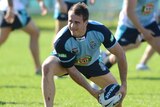 Reynolds looks to pass in Blues training