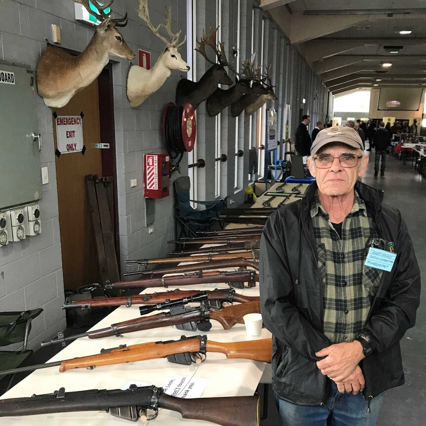 .303 collector Michael Nemet with his rifles and deer trophies