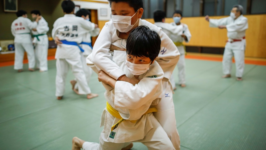 Two children train in Judo.