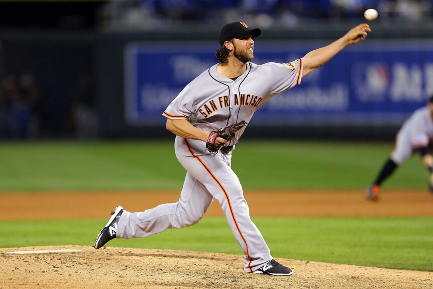 Sending down heat ... Madison Bumgarner pitches for the Giants in Game Seven