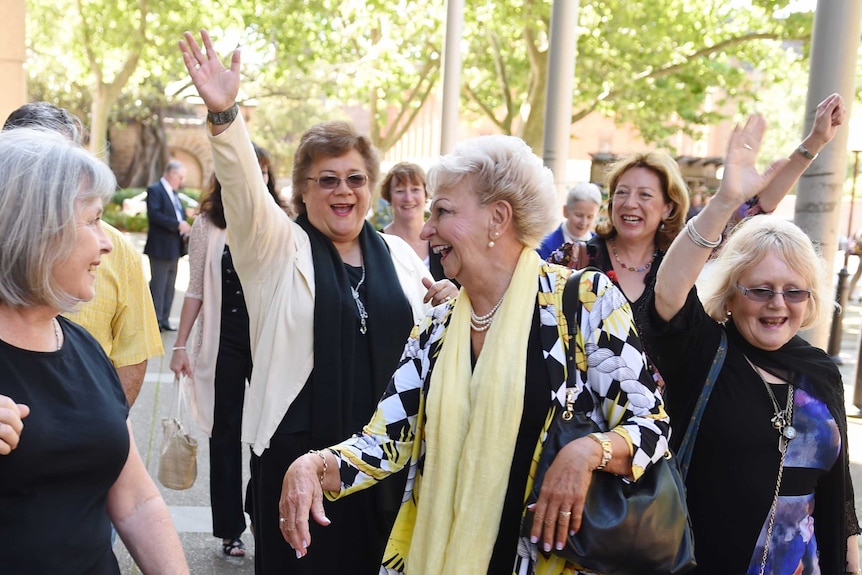 Roseanne Beckett leaves the Supreme Court with her supporter looking jubilant.