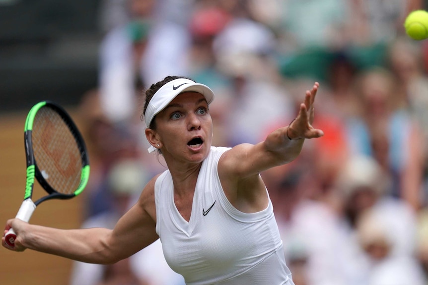 Simona Halep watches the ball drop as she prepares to hit a shot