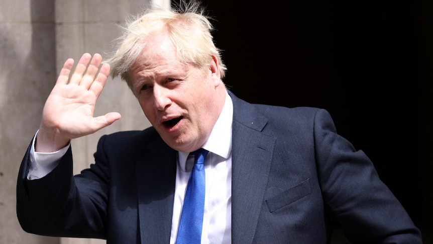 British Prime Minister Boris Johnson waves as he leave Downing Street.