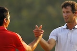 Jason Day and Adam Scott congratulate each other after finishing joint second at the 2011 Masters.