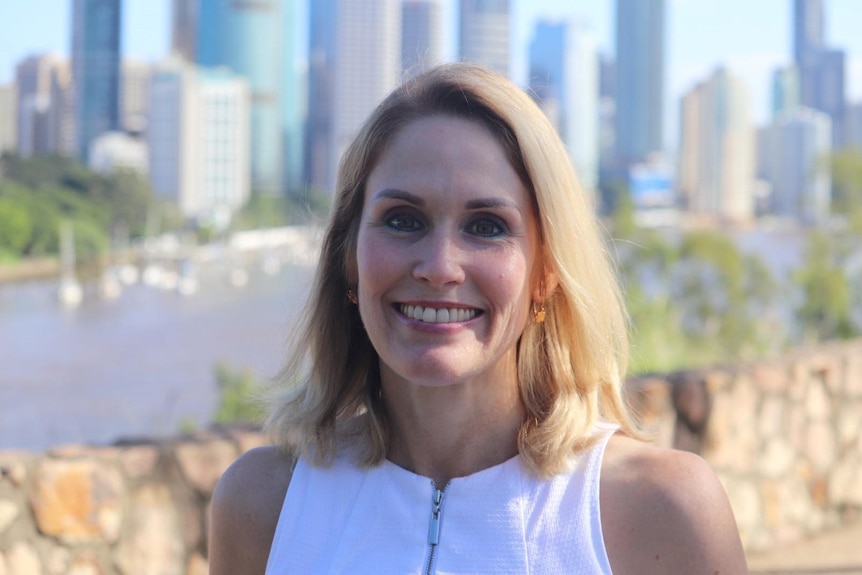 Olivia Roberts smiles as she stands at Kangaroo Point cliffs near Brisbane CBD..