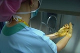 Generic TV still of anonymous nurse at unidentified Qld hospital scrubbing up for work in an operati