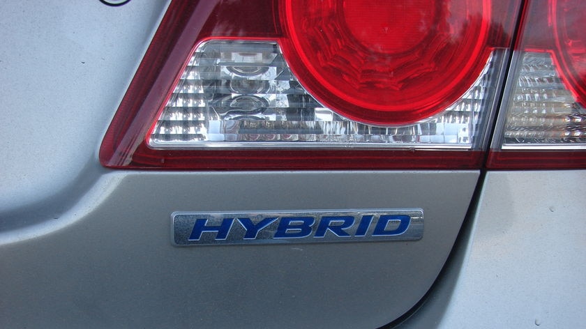 A hybrid car has a combustion engine paired with an electric battery.