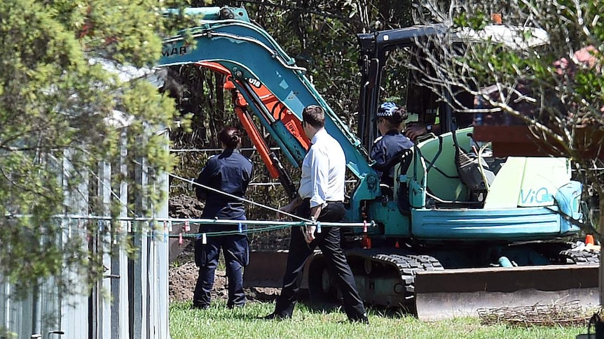 Police excavate a section behind the foster home of Queensland schoolgirl Tiahleigh Palmer