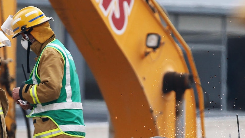 Workers sift through rubble of CTV building