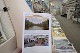 A newspaper called Wilcannia News on display in a newsagency.