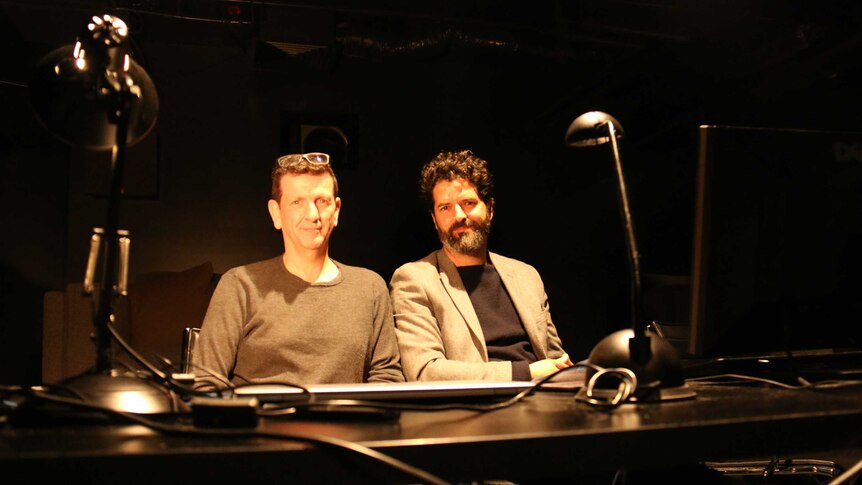 Glenn Melenhorst and Josh Simmons sit at a desk at Iloura visual effects