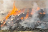 Another blaze erupts in hay bales