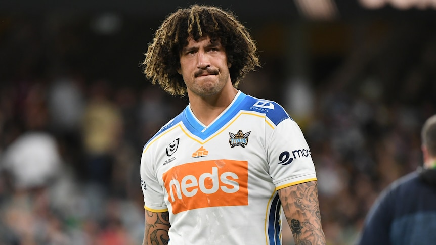 A Gold Coast Titans NRL player looks to his left during a match in 2021.