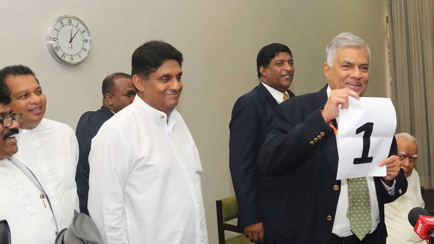 Ousted Sri Lankan Prime Minister Ranil Wickremesinghe, shows a number one sign during a media briefing held at Parliament House.