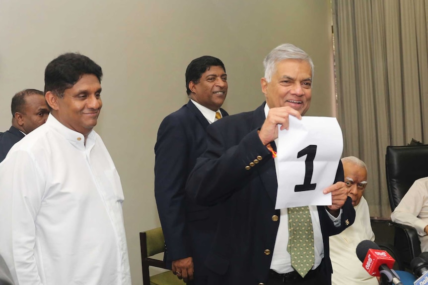 Ousted Sri Lankan Prime Minister Ranil Wickremesinghe, shows a number one sign during a media briefing held at Parliament House.