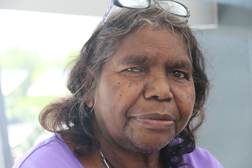 Dialysis patient Irene Nangala looks into the camera.