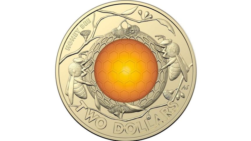 The new two-dollar coin has golden honeycomb, bees and some Eucalyptus flowers.